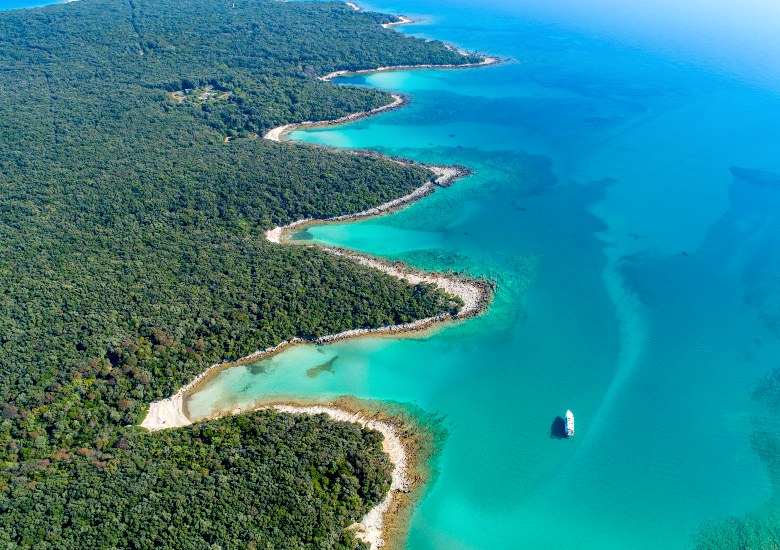 View of Cres Island from above with green interior and turquoise water