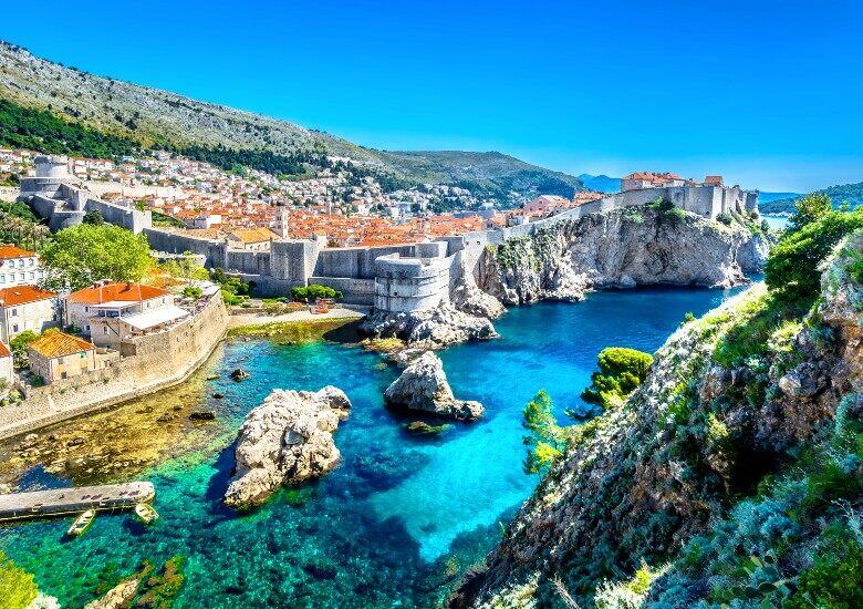 View of Dubrovnik old town with turquoise water surrounding the city walls