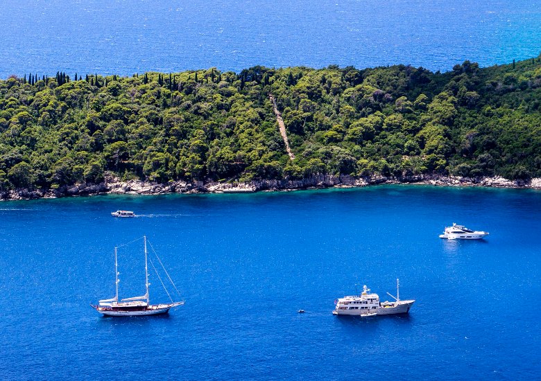 View of Lokrum Island with boats in the sea