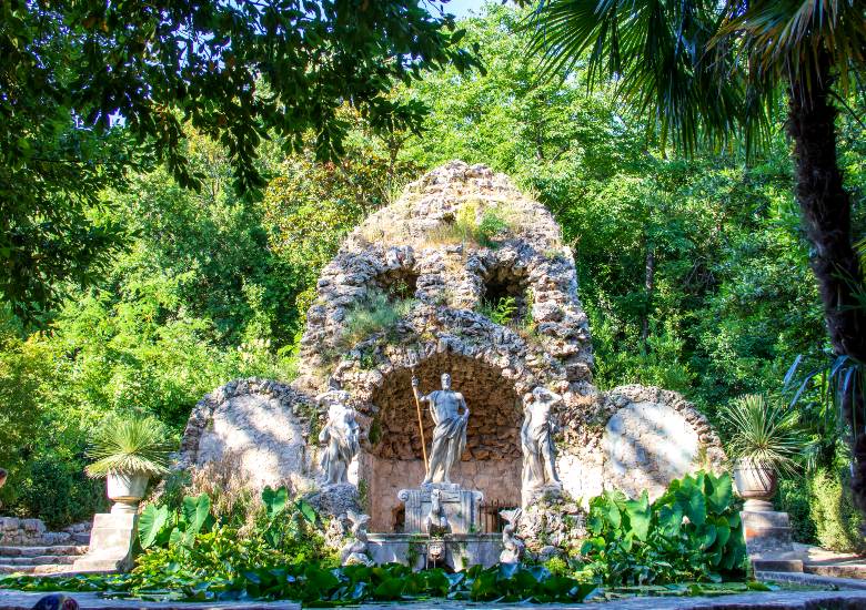 Neptune Fountain Arboretum Trsteno surrounded by green vegetation