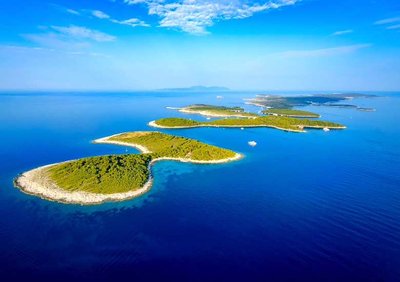 Aerial view of Pakleni Islands chain surrounded by blue water