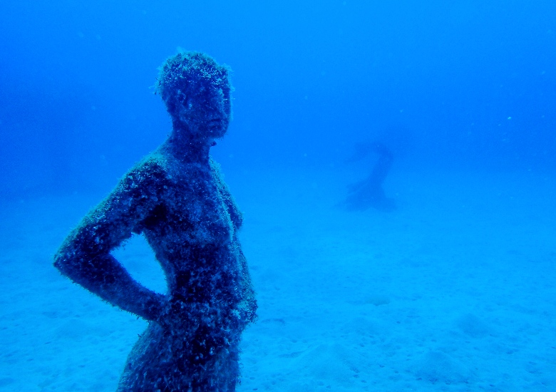 Underwater sculpture of a person